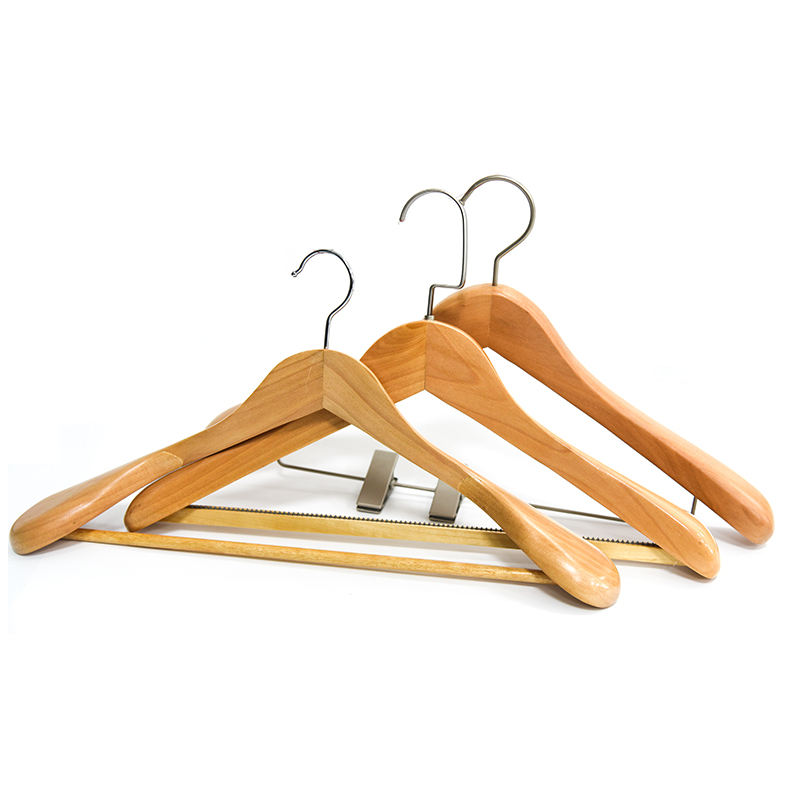 A wooden hanger is a type of hanger made from wood that is used to hang and organize clothing items such as shirts, blouses, dresses, and jackets